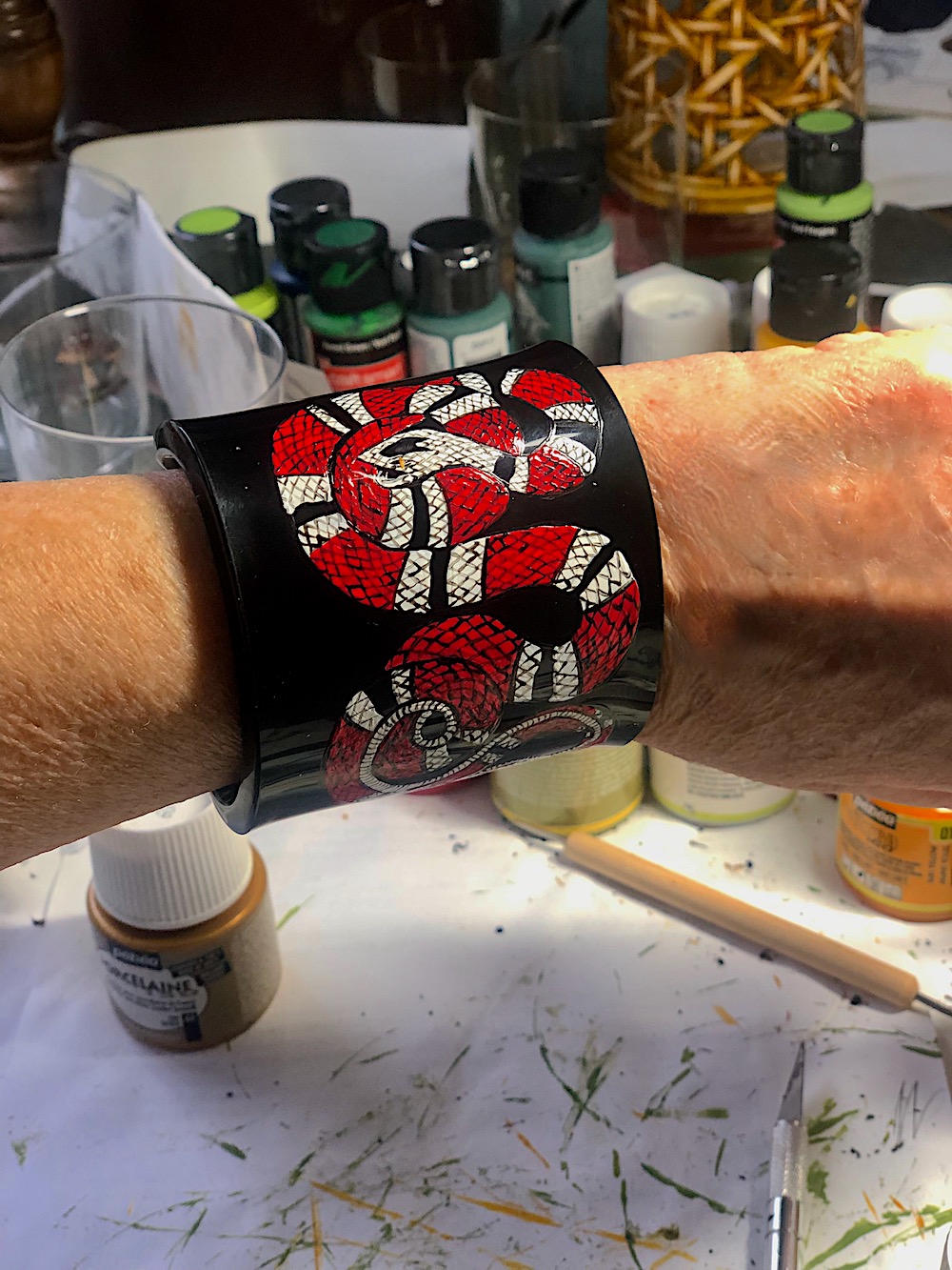 Hand painted lucite cuff via Q Worthy